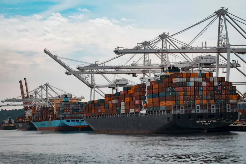 Large container ship loaded with shipping containers at sea