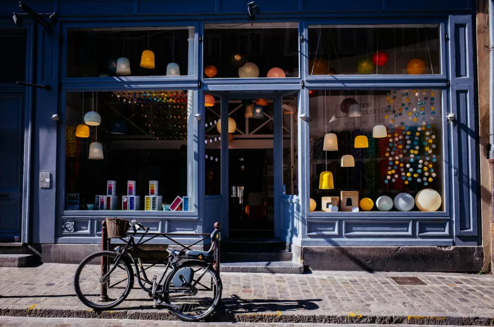 Shopfront with large windows and a bicycle parked on the pavement outside