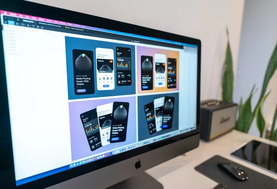 Computer monitor showing several mobile app screen designs