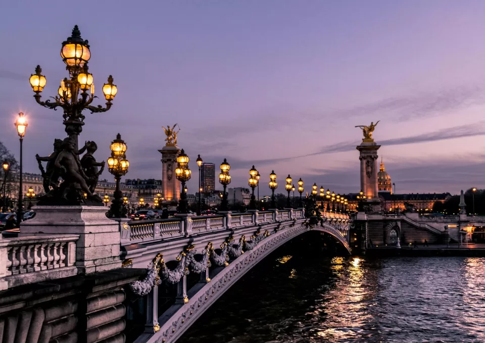Bridge over the river Seine in Paris with historic buildings