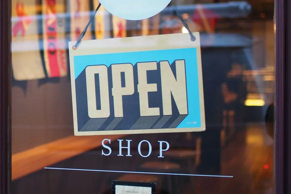 Shop window with a sign reading OPEN