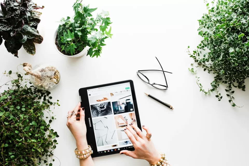 Person browsing products on a tablet while shopping online