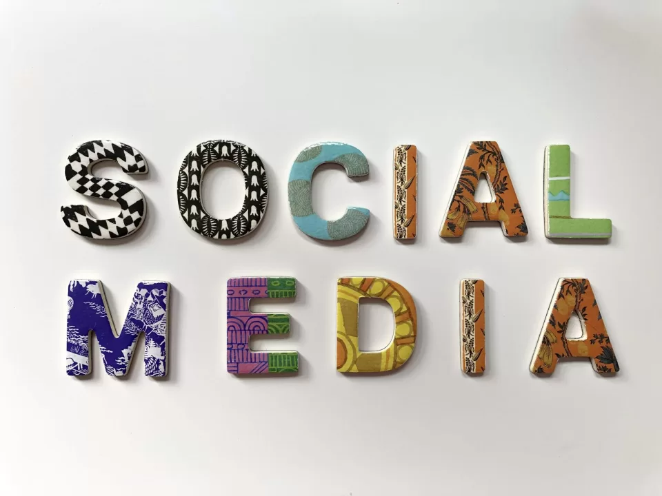 Colourful letters spelling the words social media on a white background