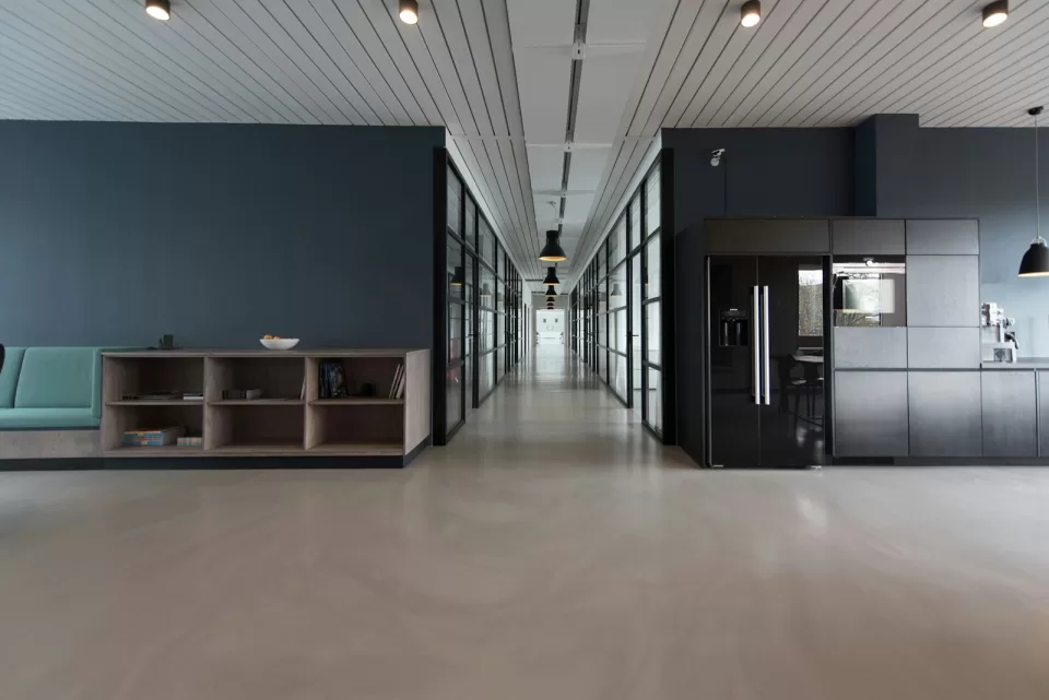 Empty modern office corridor with light grey floor