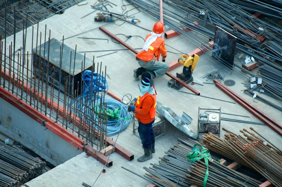 Workers in hard hats on a building site