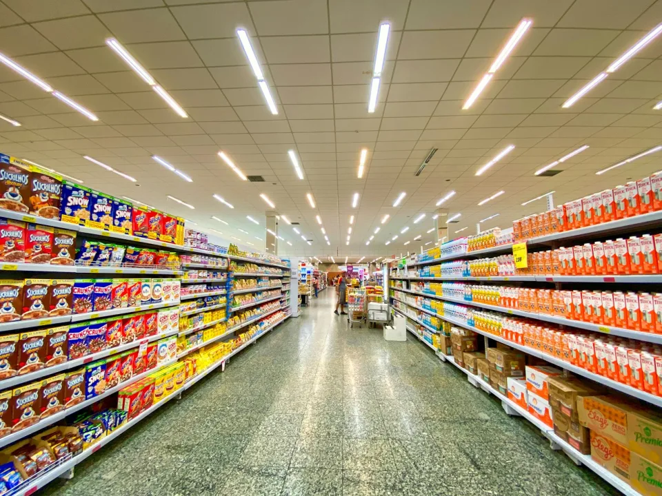 Supermarket aisle with fully stocked shelves