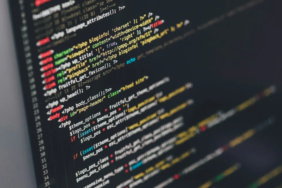 Colourful source code on a monitor
