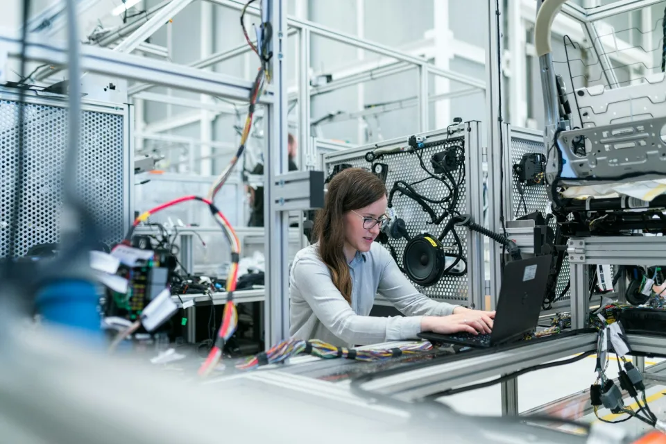 Engineer working at a laptop in a lab